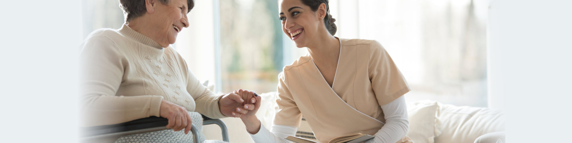 senior and caregiver smiling